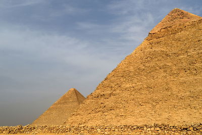 Low angle view of pyramids against sky