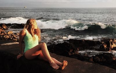 Midsection of woman at beach