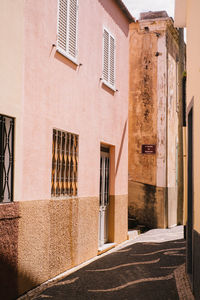 Alley amidst buildings in city