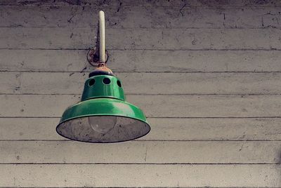 Close-up of bell hanging against wall