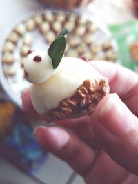 Close-up of hand holding ice cream