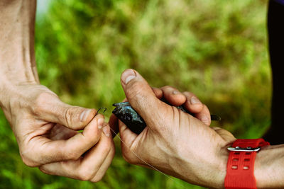 Close-up of man holding hands