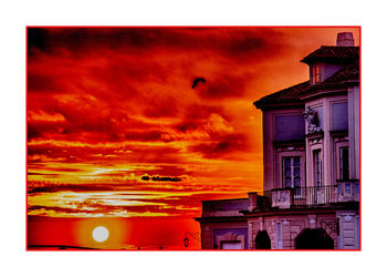 Low angle view of building against sky at sunset