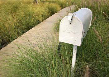 Close-up of mailbox on field