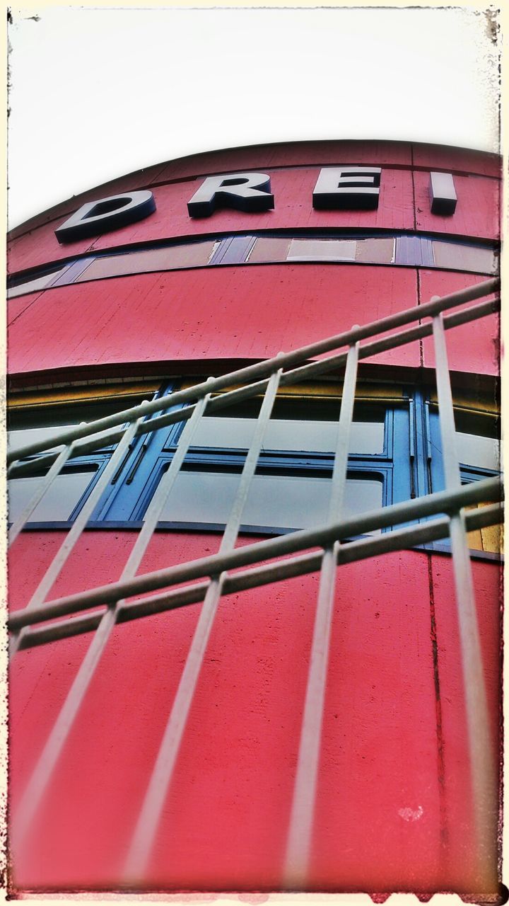 red, architecture, building exterior, built structure, window, transfer print, auto post production filter, day, low angle view, building, no people, wall - building feature, close-up, pattern, glass - material, outdoors, reflection, in a row, wall, part of