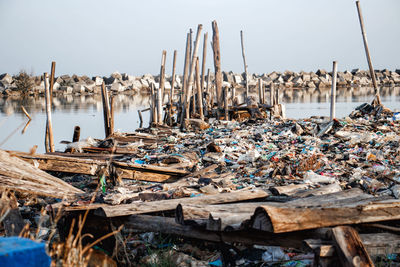 Panoramic view of wooden post on beach against clear sky