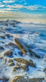 Scenic view of sea against sky during winter