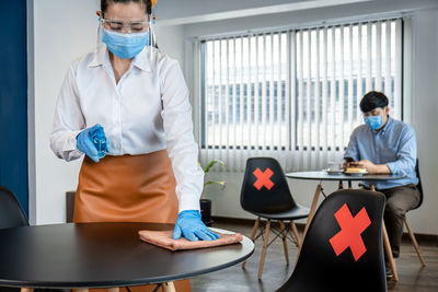 Female friends working at table