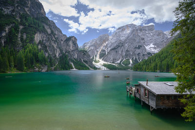 Scenic view of lake and mountains against sky