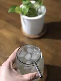 Close-up of hand holding drink