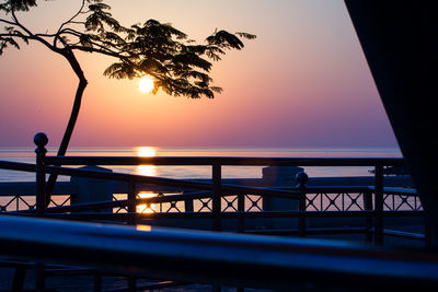 Scenic view of sea against clear sky at sunset