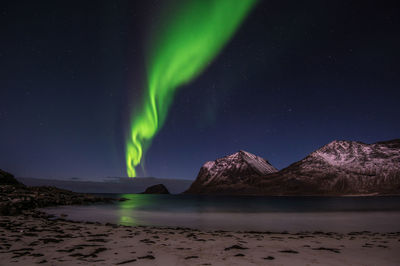 Scenic view of mountains against sky at night