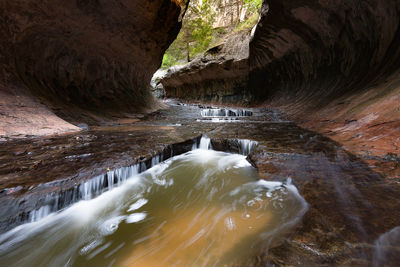 Water flowing through rocks in cave