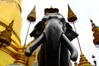 Low angle view of buddha statue