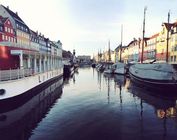 Boats moored at harbor