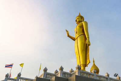 Low angle view of statue against sky