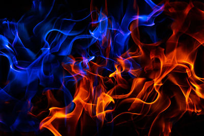 Red and blue fire on balck background composite image