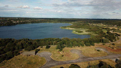 High angle view of river amidst landscape against sky