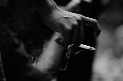 Close-up of person smoking cigarette