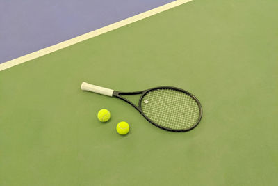 High angle view of yellow ball on green background