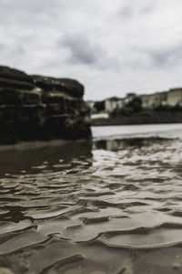 Close-up of water in sea against sky