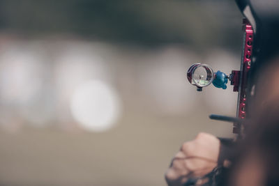 Close-up portrait of woman holding camera