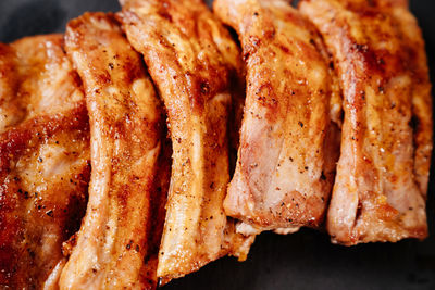 High angle view of meat on barbecue grill