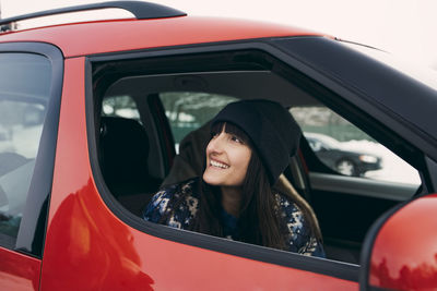 Portrait of woman sitting in car