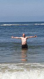 Full length of man surfing in sea