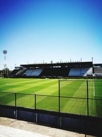 Scenic view of field against clear sky