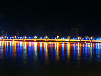 Reflection of illuminated buildings in water at night