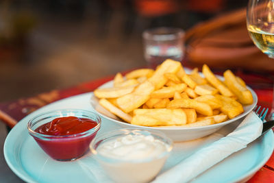 Close-up of french fries on table