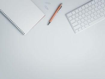 High angle view of pen on table against white background