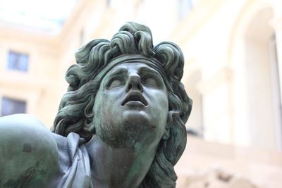 Close-up of statue against building