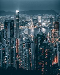 High angle view of illuminated city buildings against sky