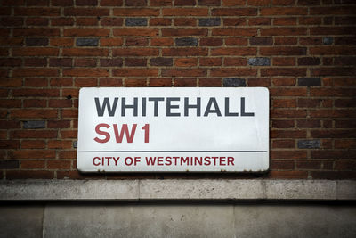 Information sign on brick wall