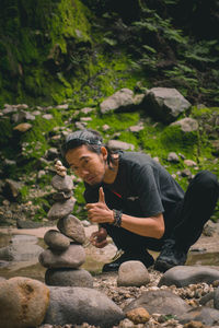 Man sitting on rock