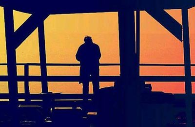 Silhouette of woman at sunset