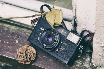 High angle view of camera on window sill