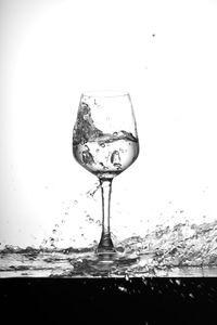 Close-up of beer in water against sky