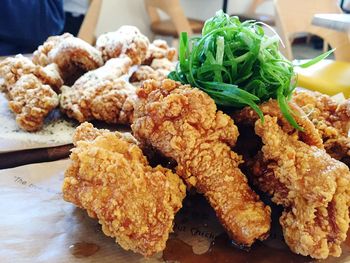 Close-up of fried chicken served on table