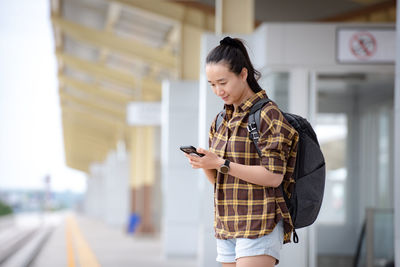 Young woman using mobile phone