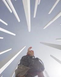 Low angle view of woman flying in hotel