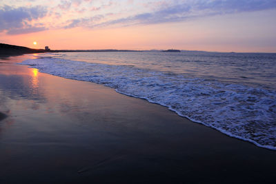 Scenic view of sea against sky during sunset