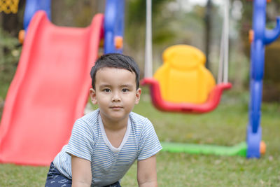 Cute boy playing on playground