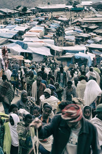 High angle view of people walking on street in city