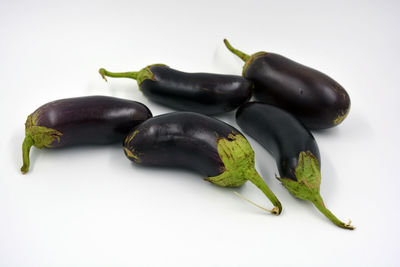 Close-up of chili peppers against white background