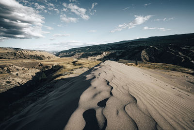 Panoramic view of desert against sky