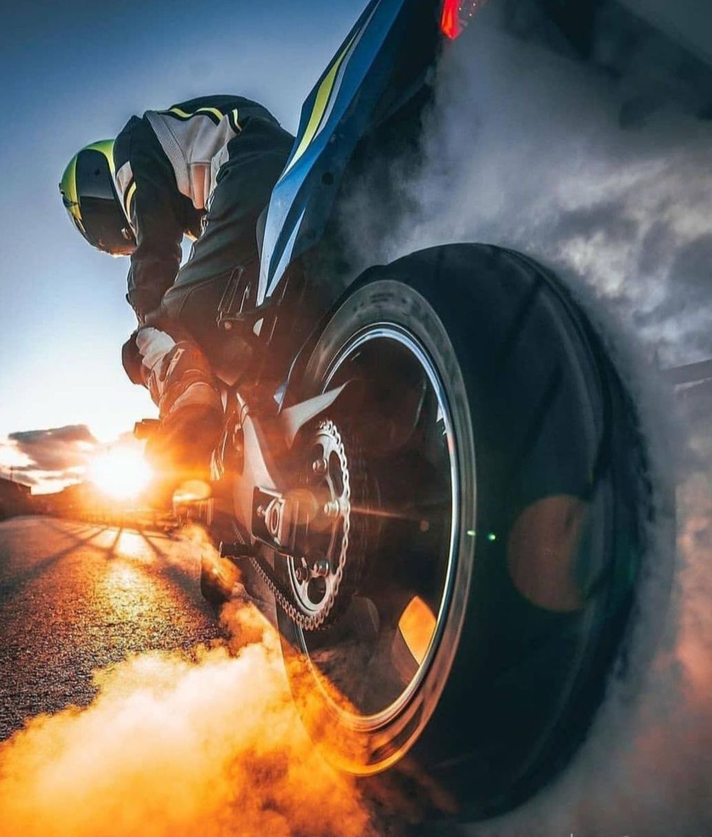 sports, stunt performer, one person, transportation, adult, motion, sports helmet, headwear, helmet, tire, speed, vehicle, wheel, mode of transportation, sky, men, nature, auto part, competition, sports equipment, smoke, activity, motorcycle, extreme sports, blurred motion, warning sign, occupation, screenshot, skill, sign, sports race, burning, lens flare, land vehicle