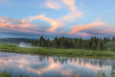 Scenic view of lake against sky during sunset